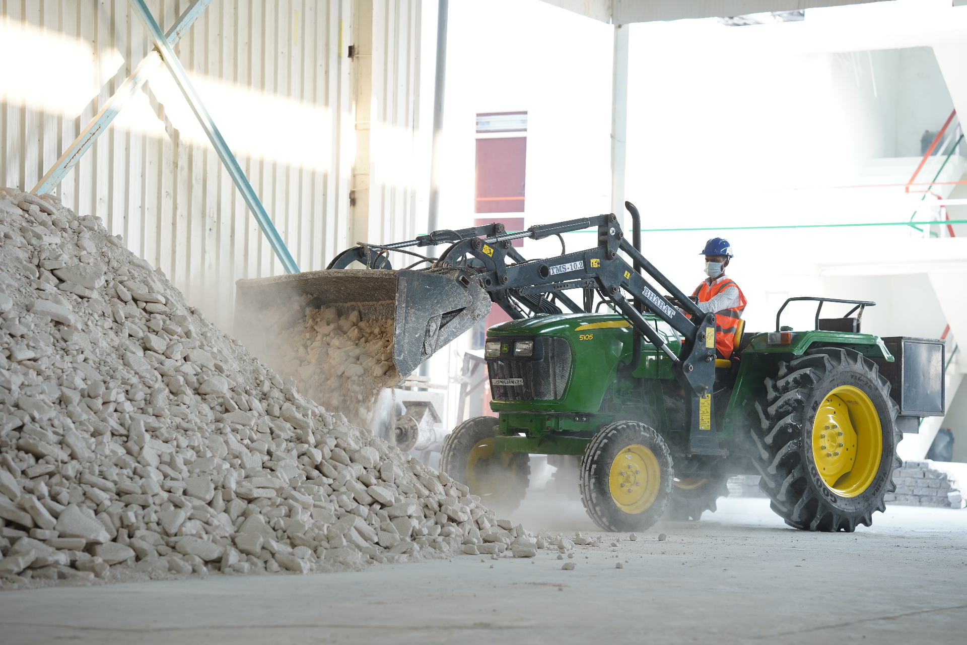 Raw kaolin lumps being loaded for processing